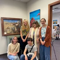 Group photo at a community art gallery exhibition