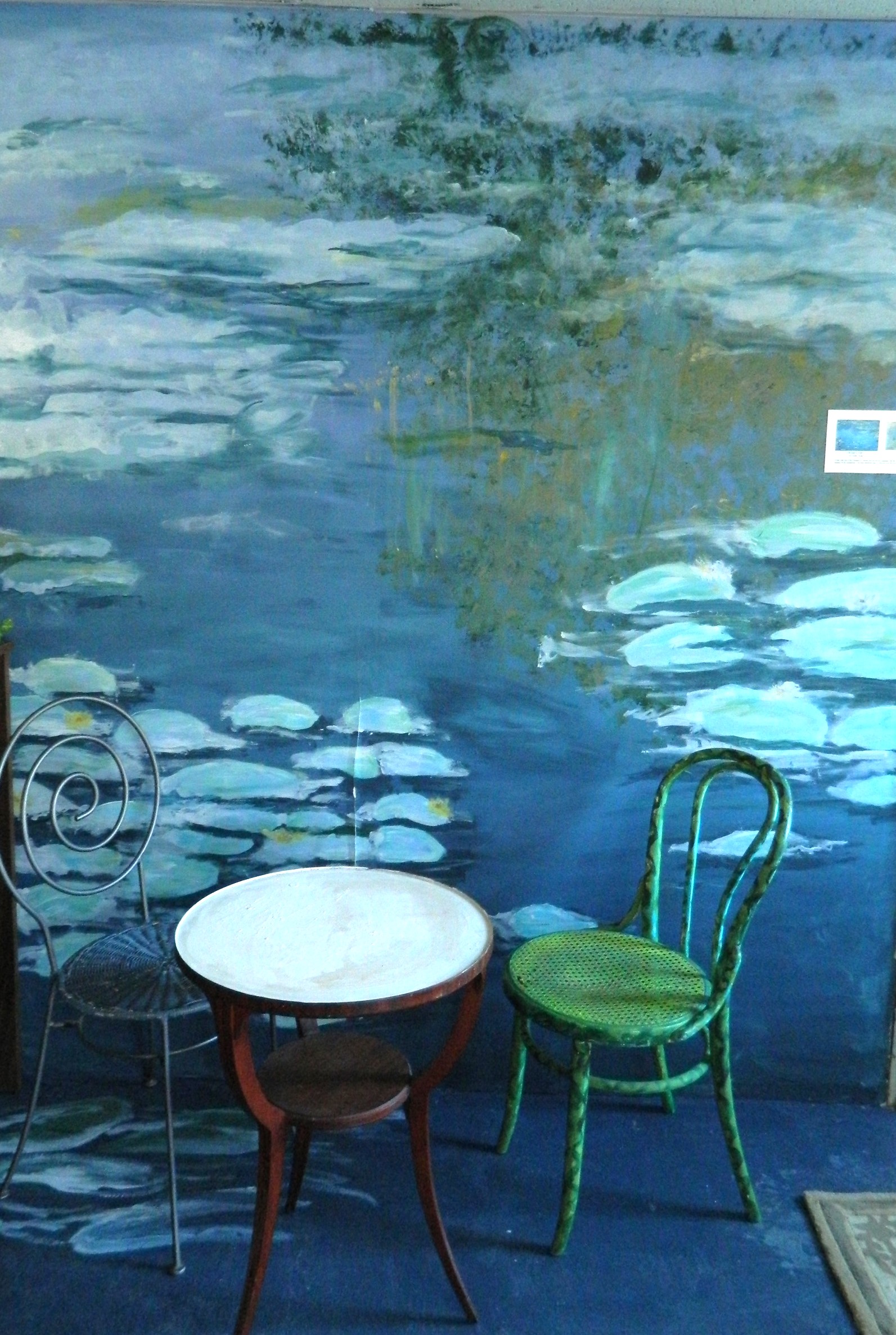 Monet water lilies mural with bistro table and chairs